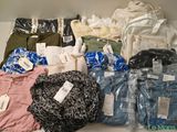 many different types of clothes on display in a box