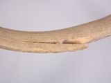 a close up of a piece of wood with a hole in it