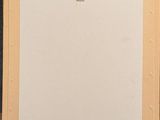 an image of a painting on a wooden table with a piece of paper