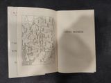 an open book with a map on it sitting on a table