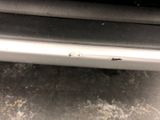 a close up of a car bumper with a lot of rust on it