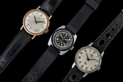 three different types of watches are shown on a black background
