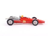 a red toy race car on a white surface
