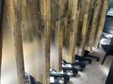several pieces of wood are stacked on top of each other in a room