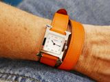 a person that is wearing a watch on their wrist