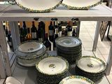 many plates and bowls sitting on a shelf in a store