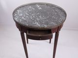 an image of a marble top table with a drawer underneath it
