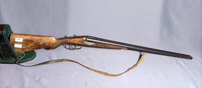 an old rifle with a leather case and a wooden handle