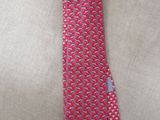 an image of a red neck tie with a blue and white design