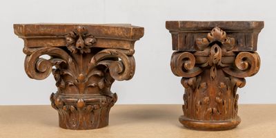 pair of antique carved wood corbs on a table