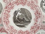 five plates with pictures of people on them on a table