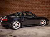 an image of a black sports car parked in a garage