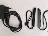 a couple of power cords and a charger on a white surface