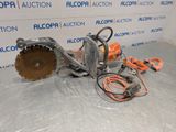 a close up of a chainsaw sitting on top of a table