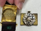 a person that is holding a watch in their hand