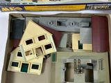 a box with a model of a house inside of it