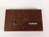 an image of a brown metal latch on a white surface