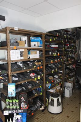 a room with a lot of items on the shelves