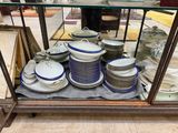 a display case with a lot of plates and bowls on it
