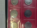 a picture of a set of six coins in a plastic case