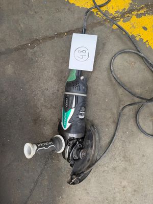 a corded drill and a corded cord on the ground