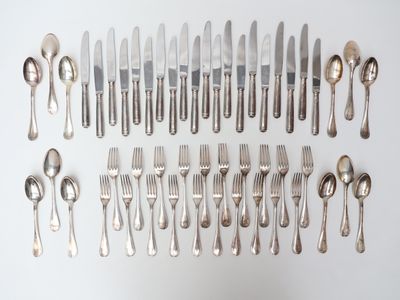 a lot of silver spoons and forks on the table