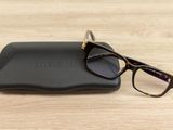 a pair of glasses sitting on top of a black case