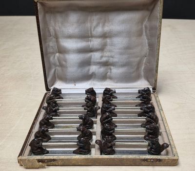 a bunch of chocolate bears in a silver case