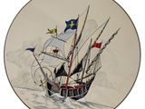 a plate with a painting of a ship in the water