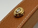 a brown leather case with a diamond on it