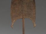sculpture of a leaf shaped object on a black base