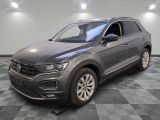 a gray volkswagen suv parked in a room with a checkered floor