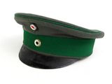 green and black military hat on a white background with a red eye