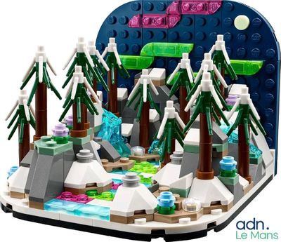 a lego model of a mountain scene with trees and rocks