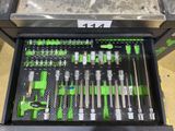 many tools in a tool box on the floor