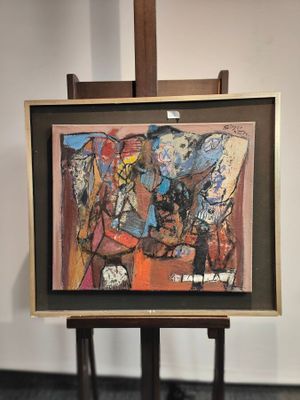 a picture of a painting on a easel in a room