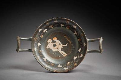 an old black and white plate with a picture of a man riding a horse