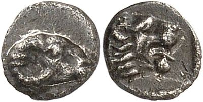 a silver coin with an image of a horse and rider on it