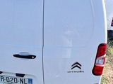 a white van that is parked in the grass