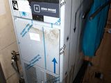 a refrigerator that has a blue towel hanging on it
