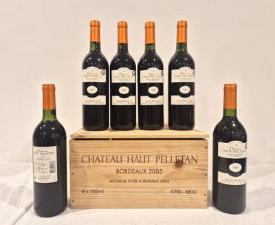 six bouteilles de vin de Bordeaux « Château Haut-Bellan » dans un coffret en bois