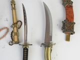 several different types of knives are displayed on a white surface