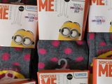 a pile of socks that have minion designs on them