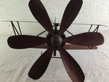 a metal fan that is sitting on a table