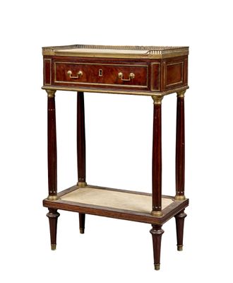 a small wooden table with a marble top and two drawers