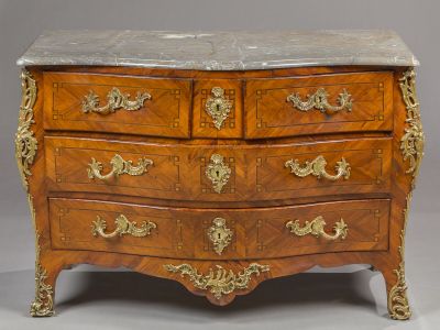 a marble top chest of drawers on display