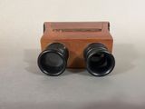 two binoculars that are sitting next to each other on a table