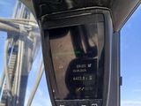 a cell phone that is sitting on the dashboard of a vehicle