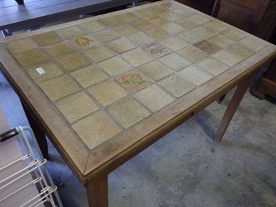 a table with a glass top and a tile pattern on it