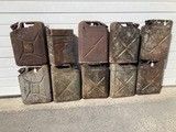 a lot of boxes stacked on top of each other in front of a garage door